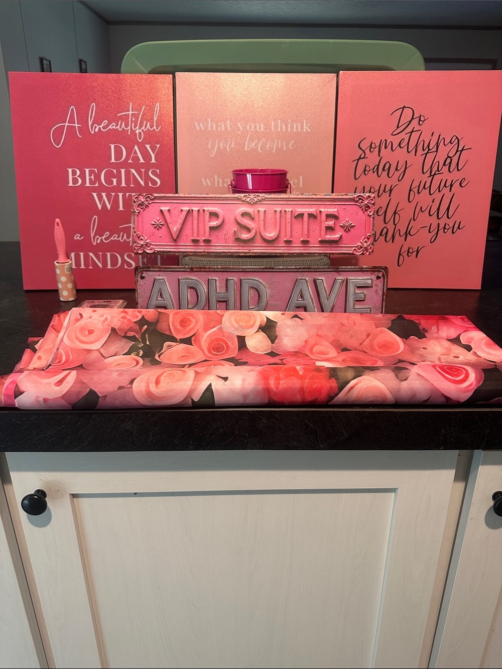 Pink Floral wall curtain with Pink Decorative Signs and metal plates.